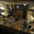 Visitors take a look around the old opera house on the second floor of the old Dixieland shoe store ...
