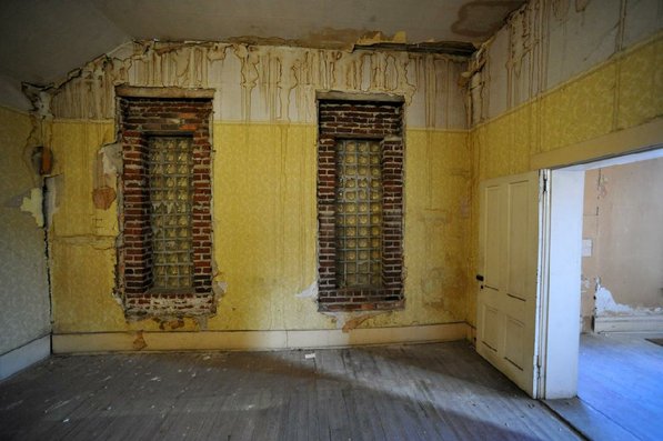 
                               
                                  Photo by Michael Woods&mdash;
                               
                           
                           One of the rooms in in need of restoration at the old opera house on the second floor of the old Dixieland shoe store on the corner of Walnut and 1st street in Rogers Wednesday morning.  John Mack, owner of JKJ Architects, recently purchase the former Dixieland Shoe store. He is restoring the building which includes the Opera House on the second floor, once a grand theater.