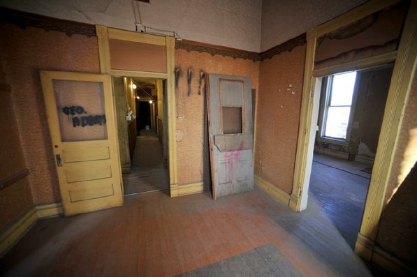 
                               
                                  Photo by Michael Woods&mdash;
                               
                           
                           One of the rooms in in need of restoration at the old opera house on the second floor of the old Dixieland shoe store on the corner of Walnut and 1st street in Rogers Wednesday morning.  John Mack, owner of JKJ Architects, recently purchase the former Dixieland Shoe store. He is restoring the building which includes the Opera House on the second floor, once a grand theater.