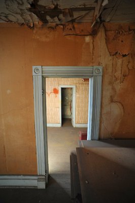 
                               
                                  Photo by Michael Woods&mdash;
                               
                           
                           One of the rooms in in need of restoration at the old opera house on the second floor of the old Dixieland shoe store on the corner of Walnut and 1st street in Rogers Wednesday morning.  John Mack, owner of JKJ Architects, recently purchase the former Dixieland Shoe store. He is restoring the building which includes the Opera House on the second floor, once a grand theater.