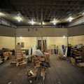 Visitors take a look around the balcony of the old opera house on the second floor of the old Dixiel...