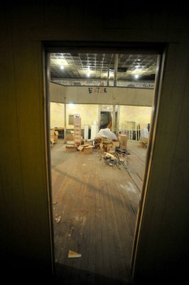 
                               
                                  Photo by Michael Woods&mdash;
                               
                           
                           Looking into the main room at the old opera house on the second floor of the old Dixieland shoe store on the corner of Walnut and 1st street in Rogers Wednesday morning.  John Mack, owner of JKJ Architects, recently purchase the former Dixieland Shoe store. He is restoring the building which includes the Opera House on the second floor, once a grand theater.