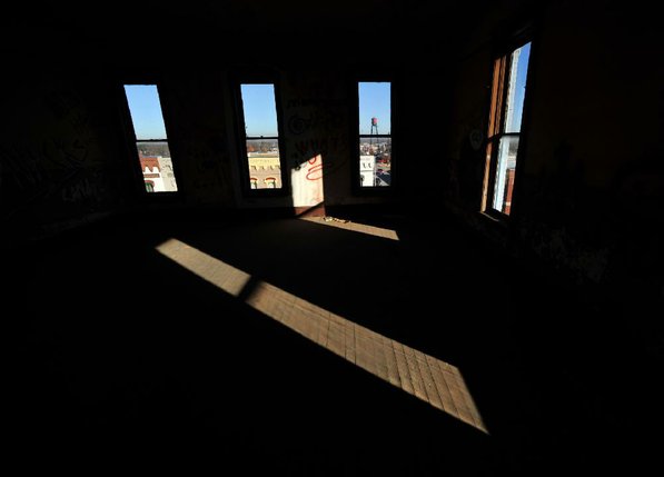 
                               
                                  Photo by Michael Woods&mdash;
                               
                           
                           Sunlight falls into a third floor room on the north east corner of the old opera house in the old Dixieland shoe store on the corner of Walnut and 1st street in Rogers Wednesday morning.  John Mack, owner of JKJ Architects, recently purchase the former Dixieland Shoe store. He is restoring the building which includes the Opera House on the second floor, once a grand theater.