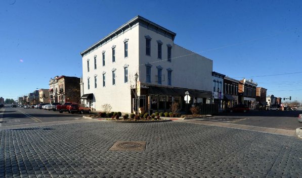 
                               
                                  Photo by Michael Woods&mdash;
                               
                           
                           The old Dixieland shoe store on the corner of Walnut and 1st street in Rogers Wednesday morning.  John Mack, owner of JKJ Architects, recently purchase the former Dixieland Shoe store on the corner of First and Walnut street. He is restoring the building which includes the Opera House on the second floor, once a grand theater.