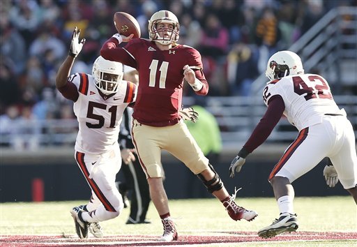 boston-college-quarterback-chase-rettig-throws-under-pressure-from-virginia-techs-bruce-taylor-51-and-jr-collins-during-the-first-half-of-a-ncaa-football-game-at-alumni-stadium-in-boston-saturday