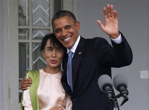 in-this-nov-19-2012-file-photo-us-president-barack-obama-waves-to-the-media-as-he-embraces-myanmar-opposition-leader-aung-san-suu-kyi-after-they-spoke-to-the-media-at-her-residence-in-yangon-myanmar-monday-the-united-states-is-unwinding-two-decades-of-sanctions-against-myanmar-as-the-countrys-reformist-leadership-oversees-rapid-fire-economic-and-political-change-obamas-visit-this-week-the-first-by-a-serving-us-president-is-a-sign-of-how-far-relations-have-come-but-washington-continues-to-take-a-calibrated-approach-to-easing-sanctions-keen-to-retain-leverage-should-myanmars-reform-momentum-stall