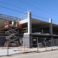 Construction crews work Wednesday on the parking deck for the 21c Museum Hotel on Northeast A Street...
