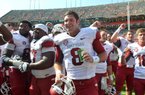 Gene Chizik’s Auburn Tigers had all the momentum from a national championship season and the accompanying exposure, and stockpiled highly rated recruits to keep the success going. The Tigers were beaten 24-7 by a struggling Razorbacks team and then things got even worse. Shown University of Arkansas quarterback Tyler Wilson celebrates with his team following the Razorbacks win over Auburn.