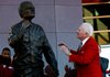 NWA Media/JASON IVESTER -- Frank Broyles admires the statue representing him during an unveiling ceremony outside the Broyles Athletic Center on Friday, Nov. 23, 2012, at Donald W. Reyonlds Stadium in Fayetteville.
