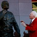 NWA Media/JASON IVESTER -- Frank Broyles admires the statue representing him during an unveiling cer...
