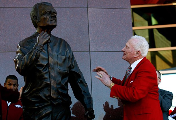 nwa-mediajason-ivester-frank-broyles-admires-the-statue-representing-him-during-an-unveiling-ceremony-outside-the-broyles-athletic-center-on-friday-nov-23-2012-at-donald-w-reyonlds-stadium-in-fayetteville
