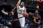 Arkansas' Rickey Scott (3) drives to the basket between Arizona State's Eric Jacobsen (3) and Carrick Felix (0) during the second half of an NCAA college basketball game at the Continental Tire Las Vegas Invitational tournament on Friday, Nov. 23, 2012, in Las Vegas. Arizona State won 83-68. (AP Photo/David Becker)
