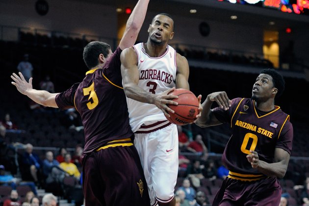 arkansas-rickey-scott-3-drives-to-the-basket-between-arizona-states-eric-jacobsen-3-and-carrick-felix-0-during-the-second-half-of-an-ncaa-college-basketball-game-at-the-continental-tire-las-vegas-invitational-tournament-on-friday-nov-23-2012-in-las-vegas-arizona-state-won-83-68-ap-photodavid-becker