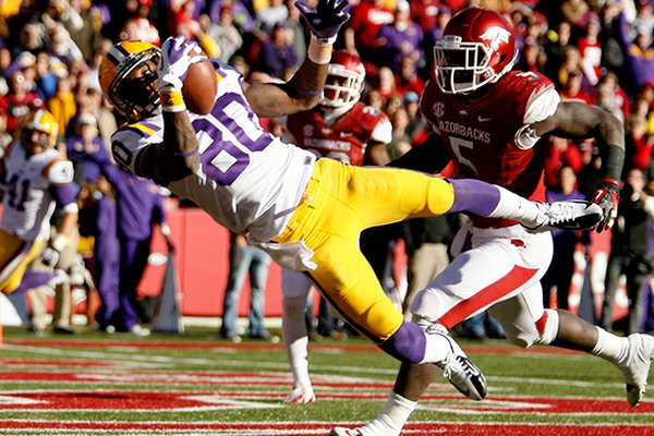 NWA Media/JASON IVESTER -- LSU wide receiver Jarvis Landry makes a catch for a touchdown in front of Arkansas linebacker Otha Peters during the second quarter on Friday, Nov. 23, 2012, at Donald W. Reynolds Razorback Stadium in Fayetteville.