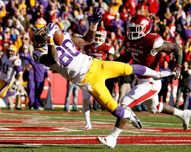 nwa-mediajason-ivester-lsu-wide-receiver-jarvis-landry-makes-a-catch-for-a-touchdown-in-front-of-arkansas-linebacker-otha-peters-during-the-second-quarter-on-friday-nov-23-2012-at-donald-w-reynolds-razorback-stadium-in-fayetteville