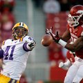 Arkansas linebacker Terrell Williams (right) breaks up a pass intended for Louisiana State tight end...