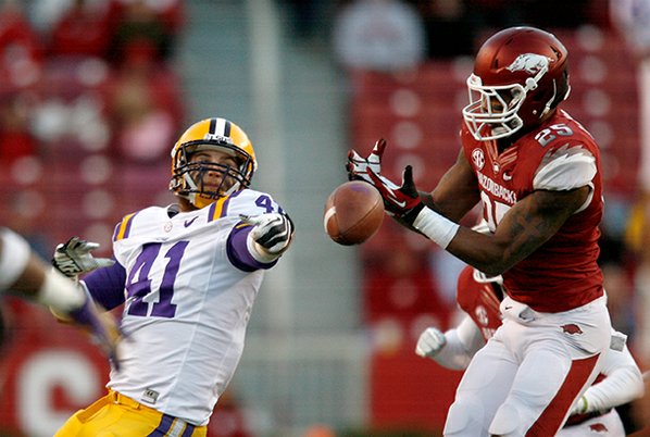 Arkansas linebacker Terrell Williams (right) ...