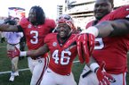 Georgia running back Todd Gurley (3), fullback Alexander Ogletree (46), and guard Mark Beard (79) celebrate their 42-10 win over Georgia Tech after an NCAA college football game, Saturday, Nov. 24, 2012, in Athens, Ga. (AP Photo/John Amis)