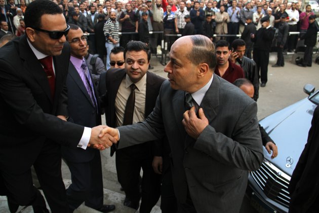 newly-appointed-egyptian-prosecutor-general-talaat-abdullah-arrives-for-work-on-his-first-day-in-office-after-being-appointed-by-president-mohammed-morsi-in-sweeping-edicts-announced-thursday-temporarily-giving-morsi-near-absolute-power-over-the-executive-judicial-and-legislative-branches-of-government-in-cairo-egypt-saturday-nov-24-2012-morsi-fired-the-controversial-former-prosecutor-general-and-created-revolutionary-judicial-bodies-to-put-mubarak-and-some-of-his-top-aides-on-trial-a-second-time-for-the-killings-of-protesters-playing-to-widespread-discontent-with-the-judiciary