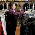 Jill Bennett of Pratt, Kan., looks through racks Friday at Fleur de Lis n Rogers.