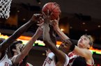 From left to right, Arkansas' Marshawn Powel, Wisconsin's Frank Kaminsky, Arkansas' BJ Young and Wisconsin's Sam Dekker (15) all get their hands on a rebound during the first half of an NCAA college basketball game at the Continental Tire Las Vegas Invitational tournament on Saturday, Nov. 24, 2012, in Las Vegas. (AP Photo/David Becker)