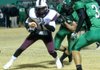Prescott running back Lavarious Martin (1) tries to get away from Greenland defender Kayden Dennis near the goal line during the first half of Friday’s game in Greenland. Prescott won 49-14. 