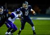 Austin Harris of Greenwood (19) looks for running room during the Bulldogs’ 42-39 victory over El Dorado on Friday in Greenwood. 