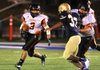Batesville running back Jose Rodriguez (3) tries to avoid a tackle by Pulaski Academy defender Sutton Bartlett (right) during the Pioneers’ 40-21 victory over the Bruins on Friday at Rector Field in Little Rock. Video is available at arkansasonline.com/videos. 