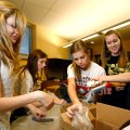 Caroline Holler, from left, Ashton Tate, Maddie Weston and Ali Chapman work to fill bags at Mary Mae...