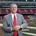 Jeff Long's football hire will have a major financial impact on the university's overall athletic pr...