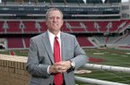 Jeff Long's football hire will have a major financial impact on the university's overall athletic program. 