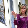 Laura Marie Rivera leads a discussion with fifth-graders on the painting “Ploughing it Under” by Tho...