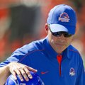 Boise State head coach Chris Petersen pats tight end Chandler Koch (88) on the helmet during warm-up...