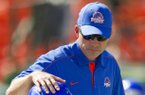 Boise State head coach Chris Petersen pats tight end Chandler Koch (88) on the helmet during warm-ups before their NCAA college football game against Hawaii on Saturday, Nov. 10, 2012, in Honolulu. (AP Photo/Eugene Tanner)