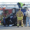 Fayetteville emergency personnel assist while a Hyundai Tucson is righted Sunday after it was involv...