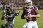 Texas A&M quarterback Johnny Manziel (2) runs from Missouri's Michael Sam (52) during the second quarter of an NCAA college football game on Saturday, Nov. 24, 2012, in College Station, Texas. (AP Photo/Dave Einsel)