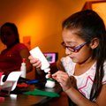 Bethany Flores, 9, of Rogers works on a snowman craft on Sunday inside the Rogers Historical Museum....