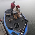 Steve Dickerson, left, of Farmington, and Jon Tuck of Fayetteville wait for fog to lift Wednesday be...