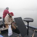 Steve Dickerson, left, of Farmington, and Jon Tuck of Fayetteville wait for fog to lift Wednesday be...