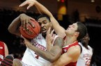 Arkansas' Coty Clarke (4) and Wisconsin's Zak Showalter (33)fight for a rebound during the first half of an NCAA college basketball game at the Continental Tire Las Vegas Invitational tournament on Saturday, Nov. 24, 2012, in Las Vegas. Wisconsin won 77-70. (AP Photo/David Becker)