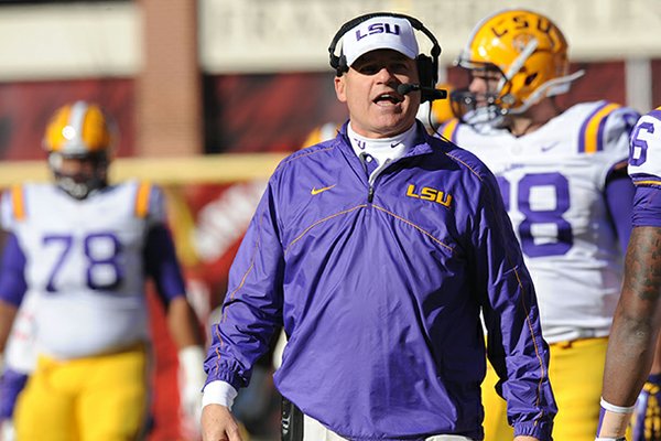 NWA Media/ANDY SHUPE -- LSU coach Les Miles speaks Friday, Nov. 23, 2012, on the sidelines during the second quarter against Arkansas at Razorback Stadium.