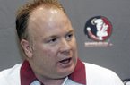 In this Aug. 12, 2012, file photo, Florida State defensive coordinator Mark Stoops is interviewed during the Seminoles' football media day in Tallahassee, Fla. Kentucky has hired Florida State defensive coordinator Mark Stoops as its new football coach. The university announced Tuesday, Nov. 27, 2012 that Stoops will replace Joker Phillips, who was fired on Nov. 4. (AP Photo/Phil Sears, File)