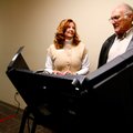Betsy Harrell
(above), county clerk office manager, helps set up the voting machine for John Brown ...