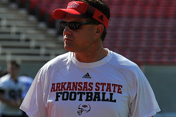 Arkansas State head coach Gus Malzahn looks on during a preseason practice in Jonesboro. 