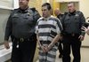 Zachary Holly, 28, of Bentonville is escorted by Benton County Sheriff's Deputies into Circuit Judge Robin Green's courtroom Wednesday, Nov. 28, 2012, for his probable cause and bond hearing at the Benton County Courthouse in Bentonville.
