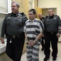 Zachary Holly, 28, of Bentonville is escorted by Benton County Sheriff's Deputies into Circuit Judge...