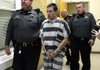 STAFF PHOTO MARC F. HENNING
Zachary Holly, 28, of Bentonville is escorted by Benton County Sheriff's Deputies into Circuit Judge Robin Green's courtroom Wednesday, Nov. 28, 2012, for his probable cause and bond hearing at the Benton County Courthouse in Bentonville.
