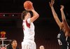 Arkansas senior post Sarah Watkins, center, takes a shot in the lane as Texas Southern junior center Crystal Anyiam defends during the first half of play Thursday, Nov. 29, 2012, in Bud Walton Arena.