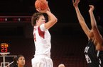 Arkansas senior post Sarah Watkins, center, takes a shot in the lane as Texas Southern junior center Crystal Anyiam defends during the first half of play Thursday, Nov. 29, 2012, in Bud Walton Arena.