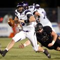 Justin Fair, a Bentonville senior defensive lineman, dives to attempt to tackle Fayetteville senior ...